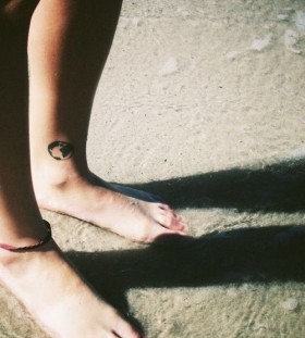 Globe tattoo on leg