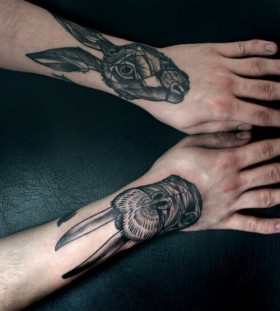 Gorgeous black rabbit tattoo on arm