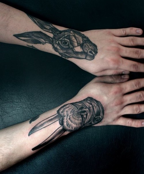 Gorgeous black rabbit tattoo on arm