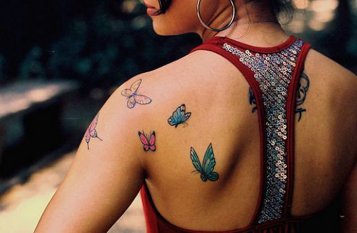 Gorgeous girl butterfly tattoo on arm