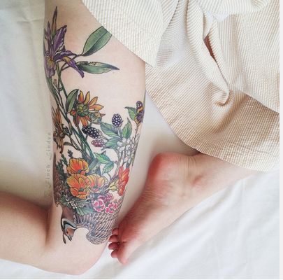 Gorgeous nature flower tattoo on leg