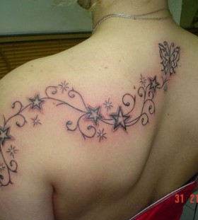 Gorgeous women star tattoo on shoulder
