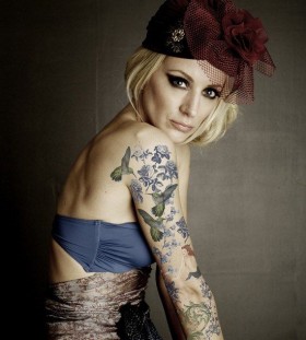 Gorgeous women's bird tattoo on arm