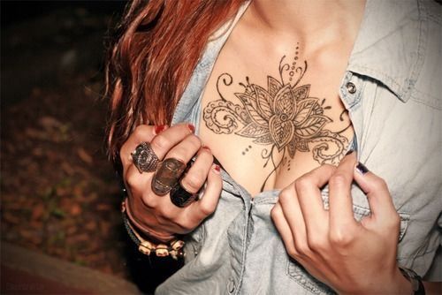 Gorgeous young girl flower tattoo on chest