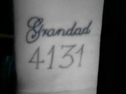 Grandad black number tattoo on arm