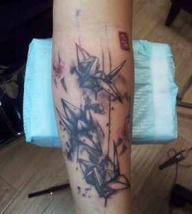 Great black origami tattoo on leg