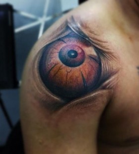 Great brown eye tattoo on shoulder
