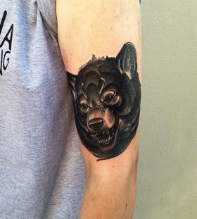 Great look black dog tattoo on arm