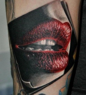 Great women's lips tattoo on arm