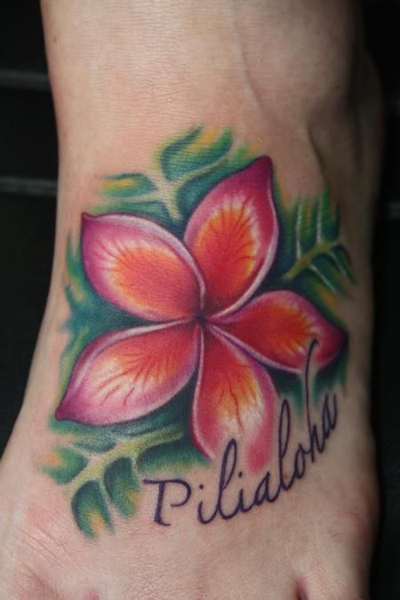 Green and red flower hawaiian style tattoo