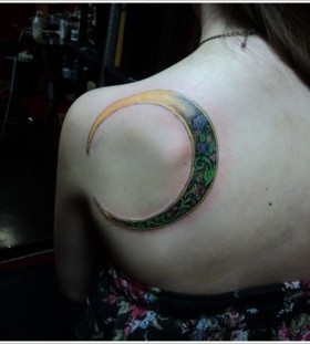Green and yellow adorable back moon tattoo