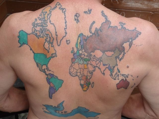 Green, black and yellow map tattoo on back