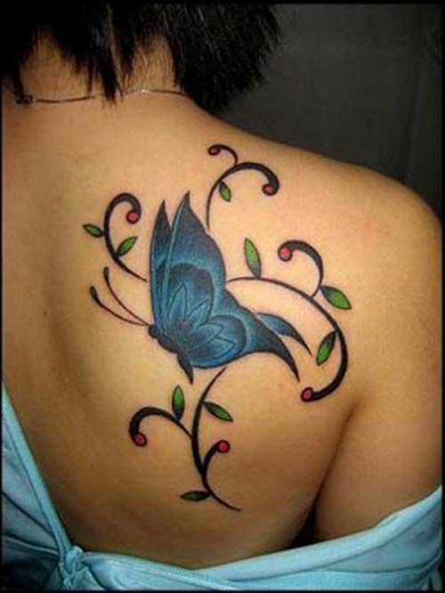 Green leaf and blue butterfly tattoo on shoulder
