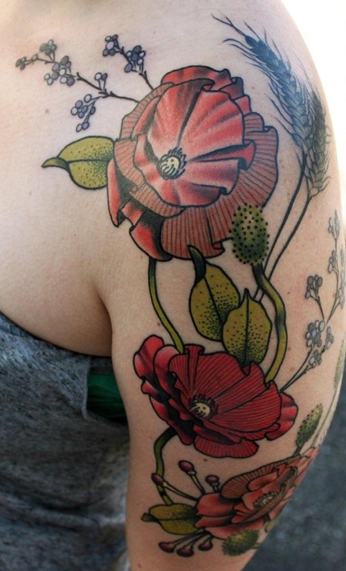 Green leafs and poppies tattoos on arm