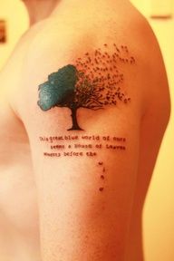 Green tree and quote tattoo on arm