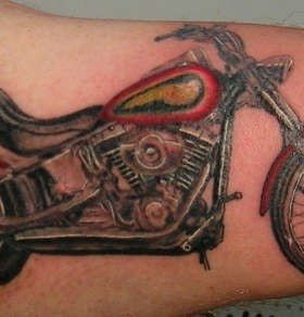 Groovy Harley Davidson bicycle tattoo on arm