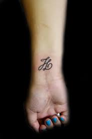 H letter tattoo on wrist