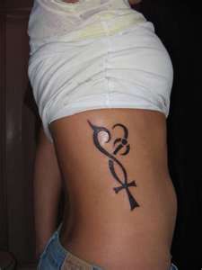 Heart and black back cross tattoo