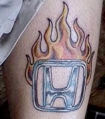 Honda fire and car tattoo on leg
