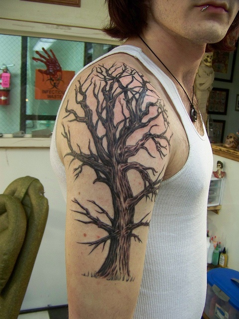Huge amazing tree tattoo on arm