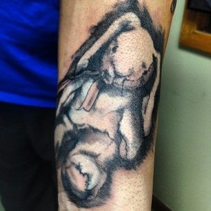 Incredible white rabbit tattoo on arm