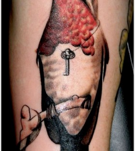Key and lovely bird tattoo on leg