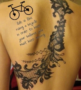 Lace and quotes bicycle tattoo on back