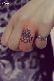 Little comic style tattoo on finger