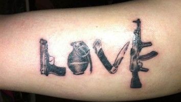 Love word from gun tattoo