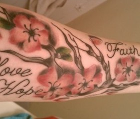 Lovely black cherry tattoo on arm