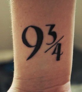 Lovely black number tattoo on arm