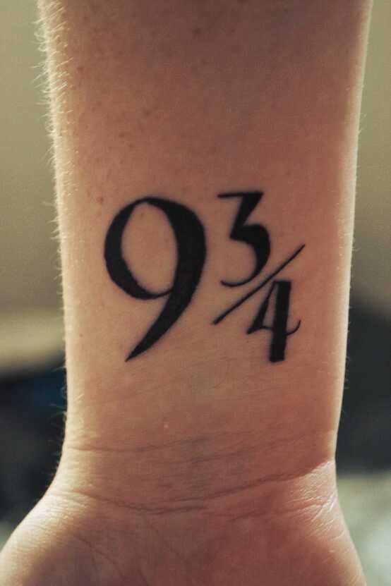 Lovely black number tattoo on arm