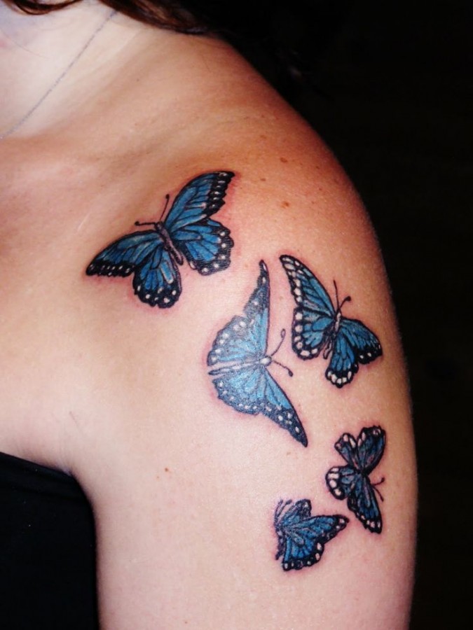 Lovely blue butterfly tattoo on shoulder