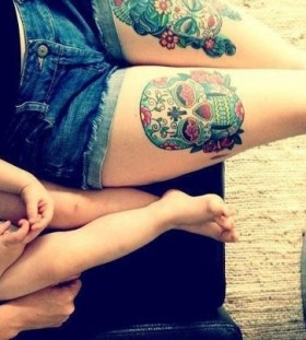 Lovely children and skull tattoo on leg