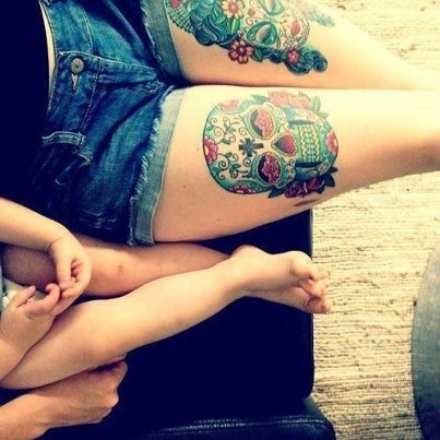 Lovely children and skull tattoo on leg