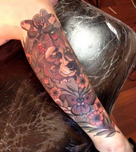 Lovely flowers and bear tattoo on leg