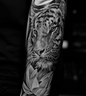 Lovely flowers and tiger tattoo on arm