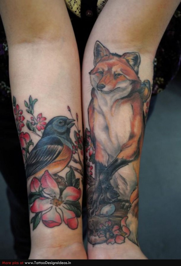 Lovely fox and bird tattoo on arm