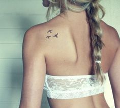 Lovely girl bird tattoo on shoulder