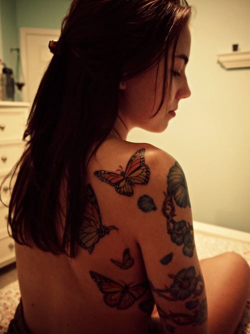 Lovely girl butterfly tattoo on arm
