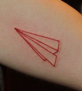 Lovely red plane origami tattoo on arm