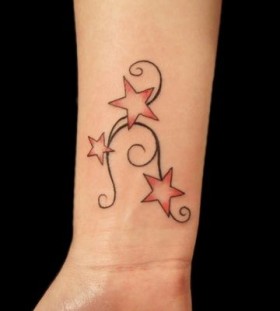 Lovely red star tattoo on arm