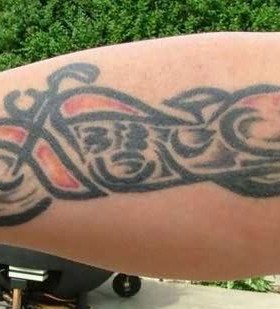 Lovely small bicycle tattoo on arm