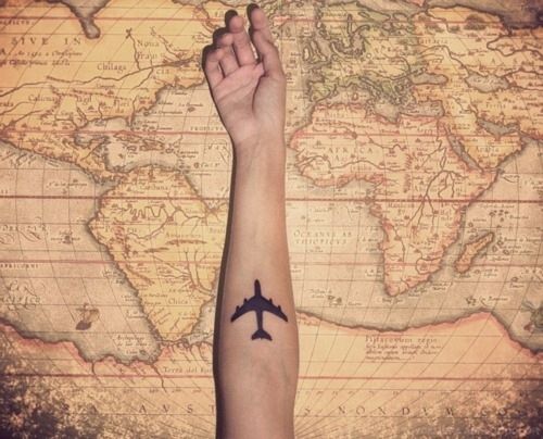 Lovely travels and plane map tattoo on arm