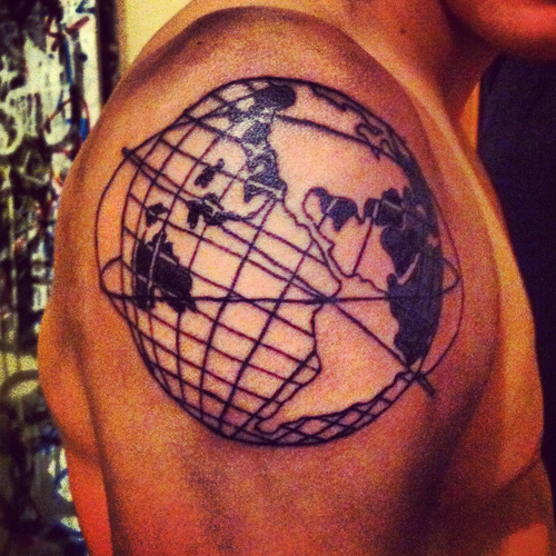 Man with globe tattoo