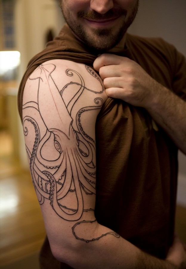 Man with octopus tattoo on arm