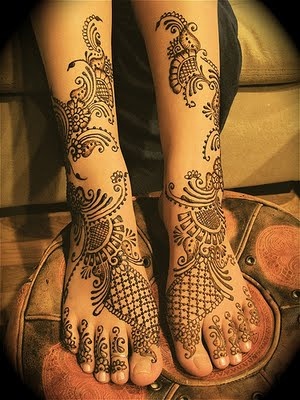 Mandala style black tribal tattoo on leg
