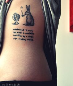 Map, quote and rabbit tattoo on body