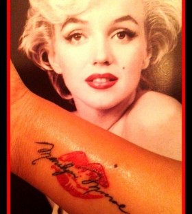 Marilyn Monroe and lips tattoo on arm
