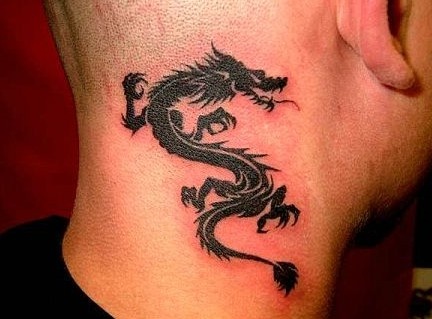 Men’s dragon tribal tattoo on shoulder